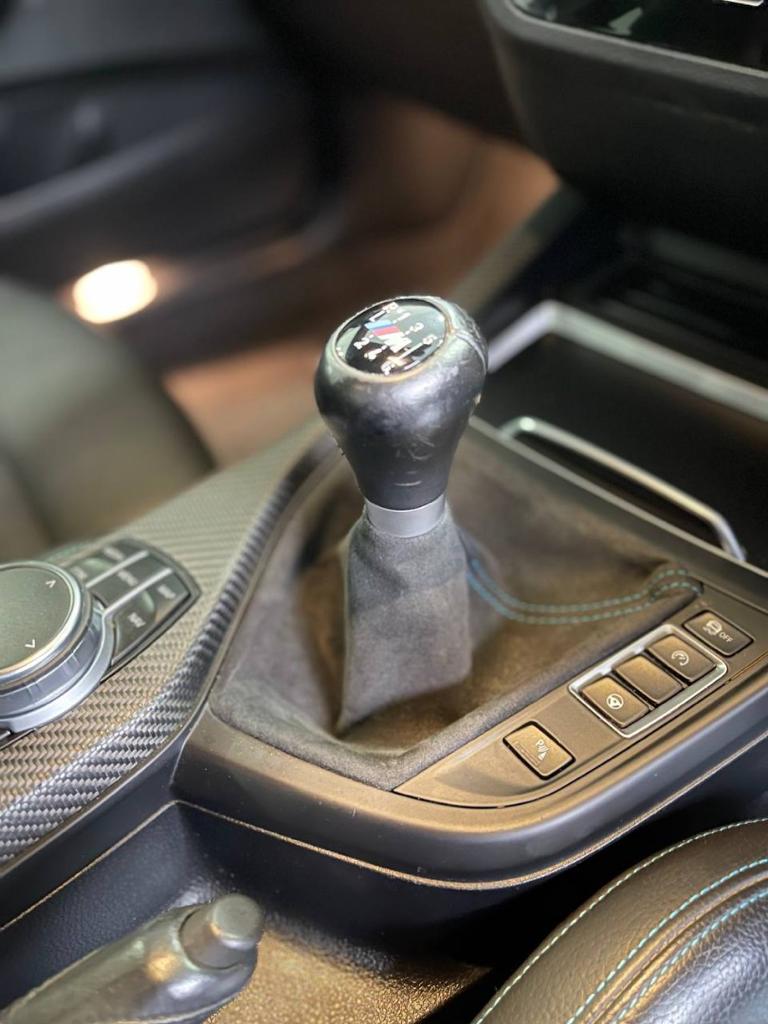 The same gear stick at a Malaysian dealership in 2022 - identical scratches